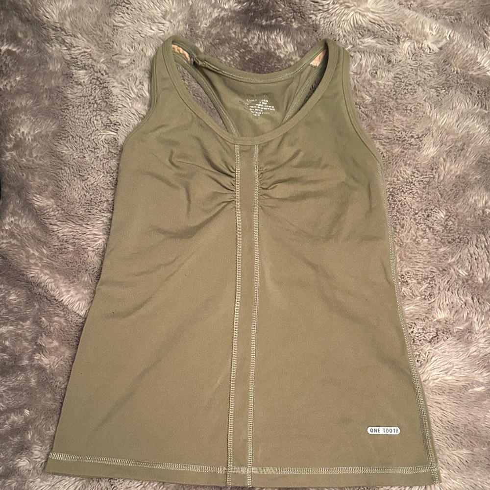 One tooth. Army green tank.